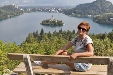 White woman and lake Bled view from above in Slovenia