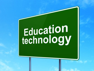 Studying concept: Education Technology on road sign background