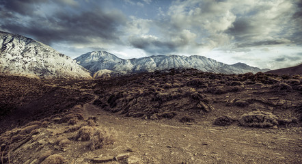 Landscape of snow mountains and desert land, Crete, Greece.
