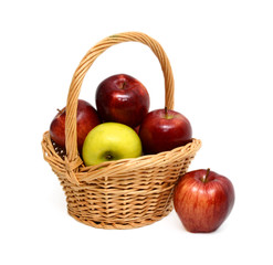 Pile of fresh apples in basket isolated on white background