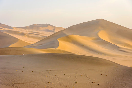 Colorful sand dunes in Gobi desert in afternoon sun, Dunhuang, China © dinozzaver