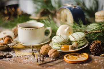 Obraz na płótnie Canvas Christmas A Cup of Coffee with Macaroons