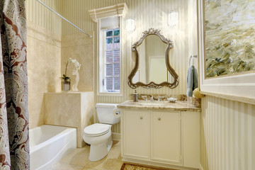 Victorian style master bathroom in warm creamy tones.