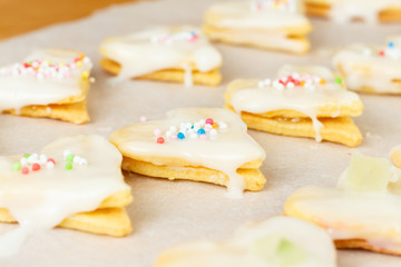 Making self-made christmas star cinnamon cookie, closeup, low focus