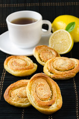 cup of hot black tea, lemon, homemade cookies