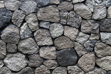 Old grey stone wall background texture