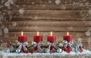 Advent decoration with four burning candles.