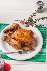 Baked chicken on white plate.