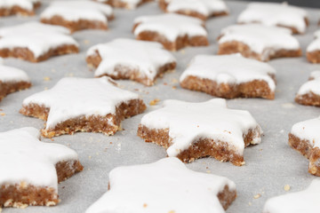 Making self-made christmas star cinnamon cookie, closeup, low focus