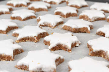 Making self-made christmas star cinnamon cookie, closeup, low focus