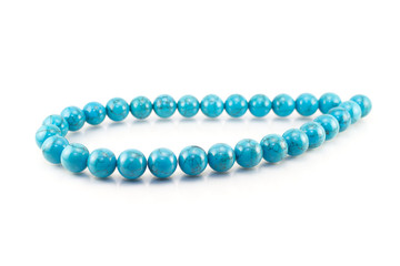 Turquoise necklace on white background