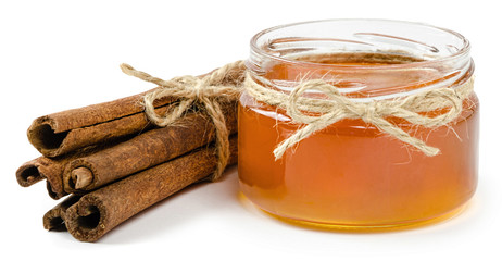honey pot cinnamon on an isolated white background