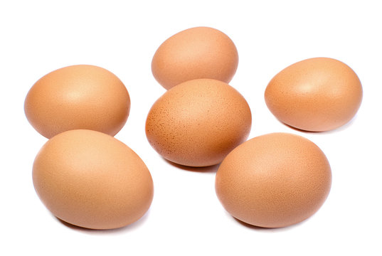 Brown chicken eggs isolated on white background