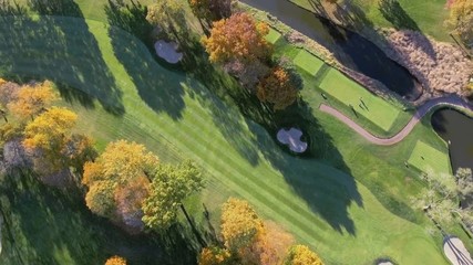 Aerial above Golf Course. Fall season with color trees