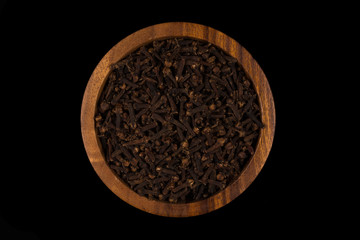 Clove spice in wooden bowl