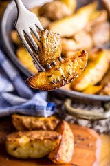 Potato. Roasted potatoes. American potatoes with salt pepper and cumin. Roasted potato wedges delicious crispy.