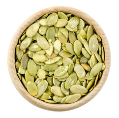 pumpkin seeds in bowl isolated