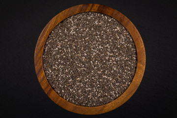 Chia seeds in wooden bowl