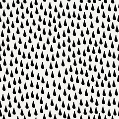 Seamless pattern with raindrops in black on cream background.