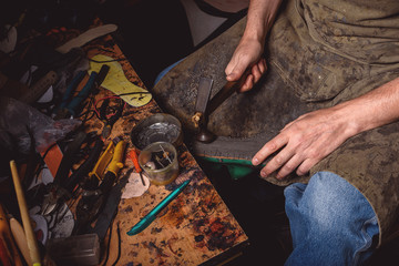 handyman forming the silhouette of a sole