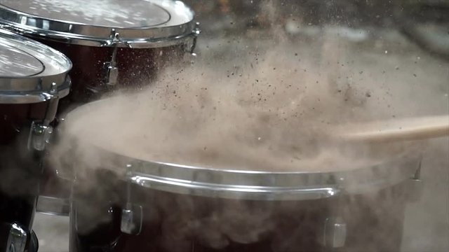 blowing up sand on drum