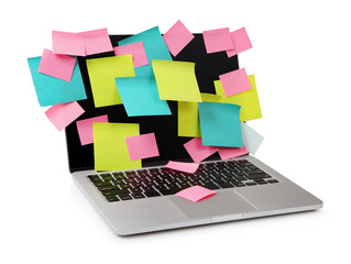Image of laptop full of colorful sticky notes reminders on scree