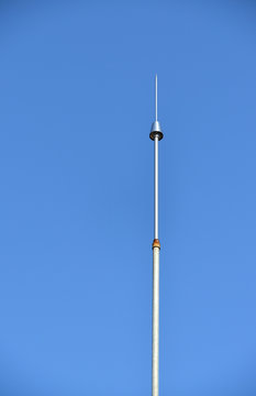 Lightning rod against the clear blue sky