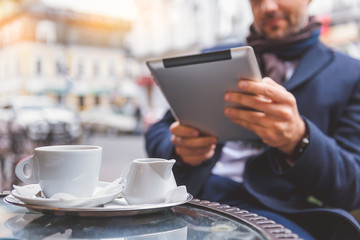 Businessman using modern technology on break