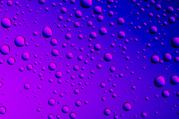 Nice blue purple color background from drops of the different size