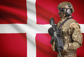 Soldier in helmet holding machine gun with flag on background series - Denmark