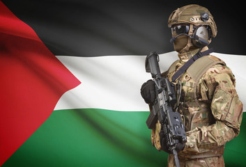 Soldier in helmet holding machine gun with flag on background series - Palestine