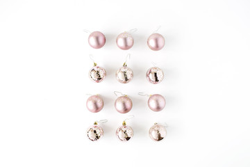 creative arrangement of bright christmas balls on white background. flat lay, top view