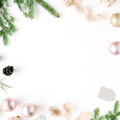 Christmas composition. Frame with fir branches, pine cones, christmas balls, ribbon and tinsel. Flat lay, top view