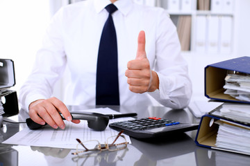 Revenue Service inspector is ready for helping and consulting clients. Audit concept.