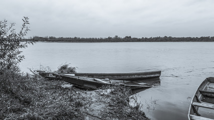 Old boats on the river bank