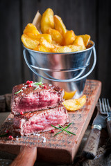 Homemade steak and chips with salt and rosemary