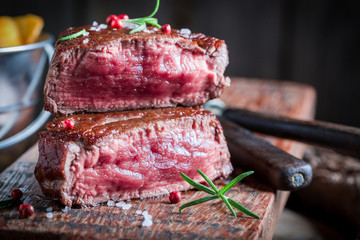 Tasty chips and steak with rosemary and salt