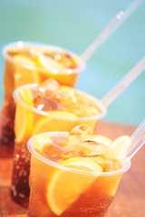 Concept of luxury tropical vacation. Three Cuba Libre cocktails