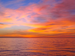 Naklejka na ściany i meble Colorful sunrise with clouds over the sea 6