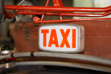 Sign Taxi vintage old background on the red