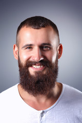 Obraz premium Portrait of handsome man standing, isolated on grey background