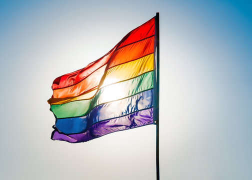 Rainbow Gay Pride Flag on blue sky background, Miami Beach, Flor