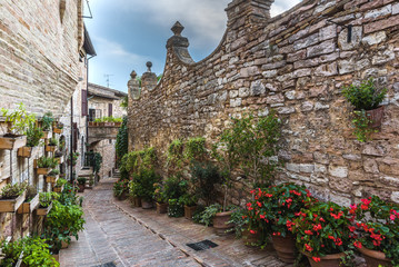 Surprising appearance of streets full of flowers in Spello, Umbr