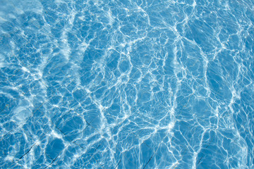 Surface of swimming pool water background