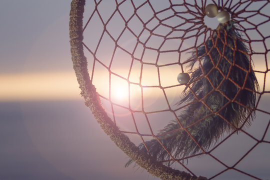Sunset through a dreamcatcher