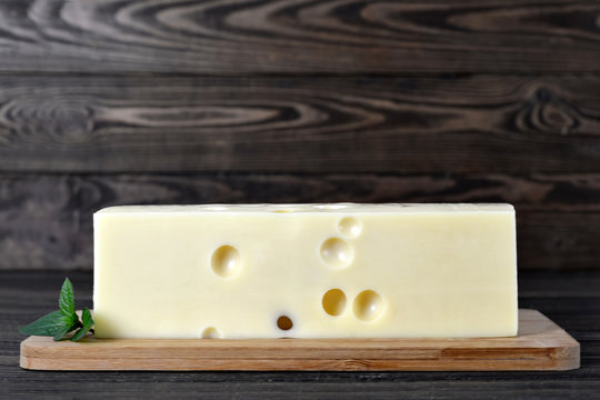 Emmental cheese on wooden board