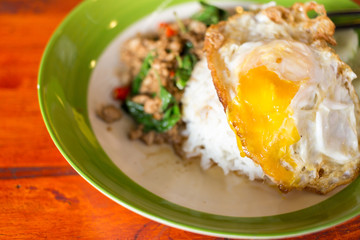 Thai spicy food basil chicken fried rice recipe with fried egg,f