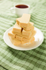 Wafer biscuits served with tea.