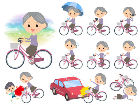 Purple clothes grandmother ride on city bicycle