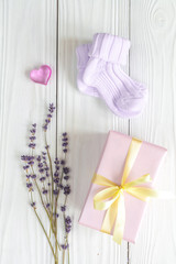 baby accessories with lavender for the bathroom on wooden background
